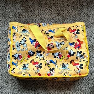 Mickey Mouse takes you back in time with this vibrant tote bag!